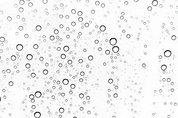 Fototapeta premium Krople deszczu na powierzchni szyb w oknie Natural Pattern of raindrops. Naturalny wzór kropel deszczu na białym tle do projektowania.