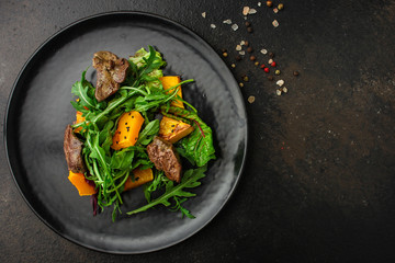 healthy salad with liver (tasty appetizer) menu concept. food background. copy space. Top view