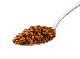 Instant coffee in a spoon closeup on a white. Isolated.