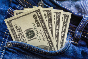 Dollar money in the  pocket of jeans. Banknote One hundred dollar. The concept of finance. Close-up. Copy space. for your background.