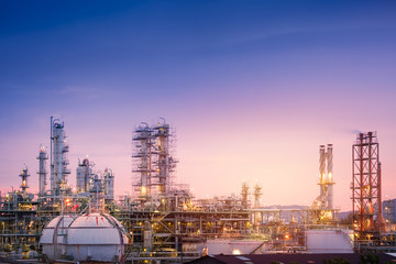 Oil and gas refinery plant or petrochemical industry on sky sunset background, Factory with evening, Gas storage sphere tank in petrochemical industrial