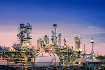 Oil and gas refinery plant or petrochemical industry on sky sunset background, Gas storage sphere...