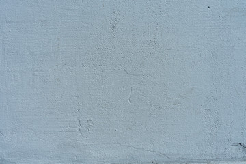 Texture of blue stone or cement wall in sunlight for pattern, background or 3D. Horizontal, close up