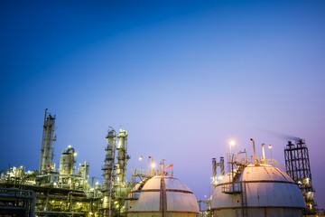 Glitter lighting of industrial plant with storage sphere tanks at twilight time, Manufacturing of petrochemical plant