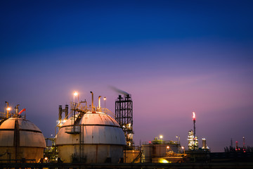 Storage sphere tanks in Oil and gas refinery industrial with twilight sky background