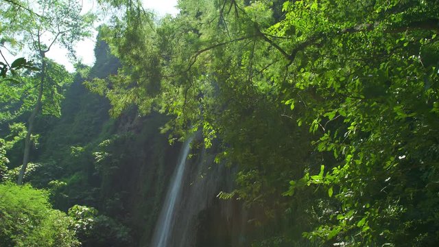 Amazing Unseen Waterfall view in deep forest Lush green leafes and sunshine in the morning. Saraburi Asia Thailand