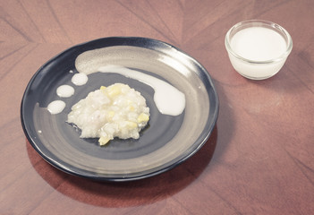 Sticky rice boiled in syrup with corn and sweet potato. Thai dessert