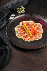 duck meat carpaccio with pear flambe (tasty snack, aperitif) menu concept. food background. copy space. Top view