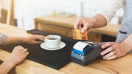 Credit card payment in cafe for morning coffee