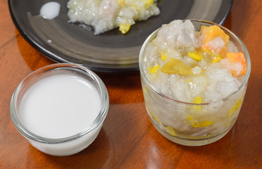 Sticky rice boiled in syrup with corn and sweet potato. Thai dessert