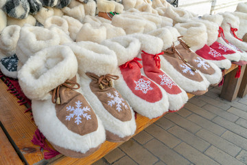 colorful home shoes on shelf at a market