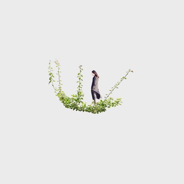 Woman standing on leaves, Jeju, South Korea