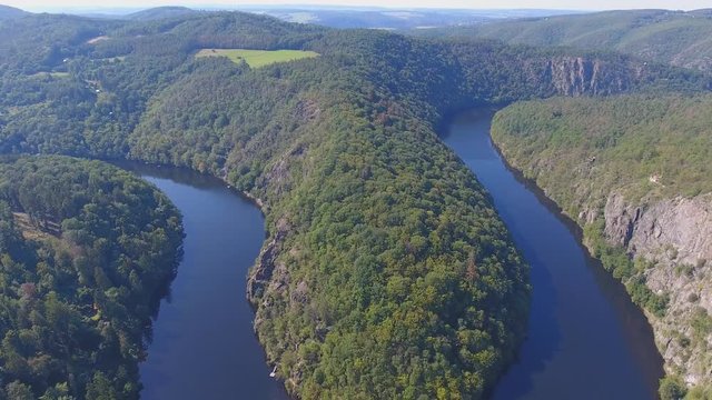 Aerial view of Vltava river horseshoe meander with green forest near Maj view point next to Prague in central Bohemia, Czech republic