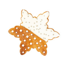 Traditional Christmas gingerbread in the shape of snowflake isolated on white background.