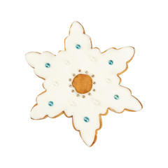 Traditional Christmas gingerbread in the shape of snowflake isolated on white background.