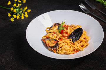 pasta with mussels (tagliatelle seafood) menu concept. food background. copy space. Top view