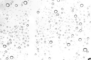 Rain drops on window glasses surface Natural Pattern of raindrops. Natural pattern of raindrops on white background for your design.