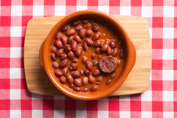 Dish of red beans in clay pot.