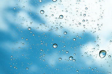 Rain on the window, natural skin of the rain The natural form of rainwater on a sky background.