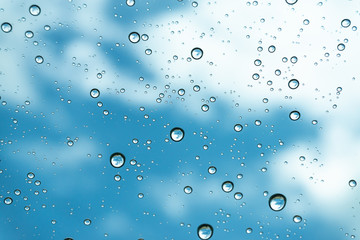 Rain on the window, natural skin of the rain The natural form of rainwater on a sky background.