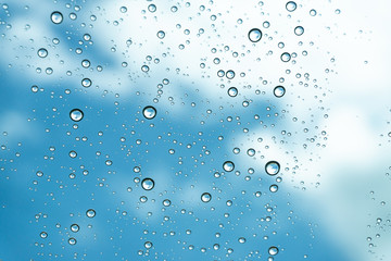 Rain on the window, natural skin of the rain The natural form of rainwater on a sky background.