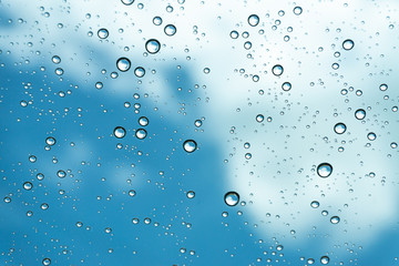 Rain on the window, natural skin of the rain The natural form of rainwater on a sky background.