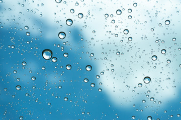 Rain on the window, natural skin of the rain The natural form of rainwater on a sky background.
