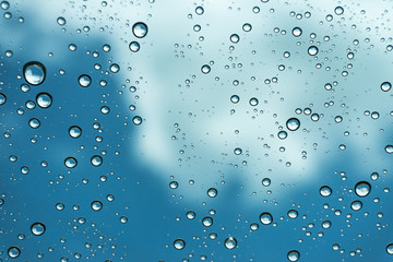 Rain on the window, natural skin of the rain The natural form of rainwater on a sky background.