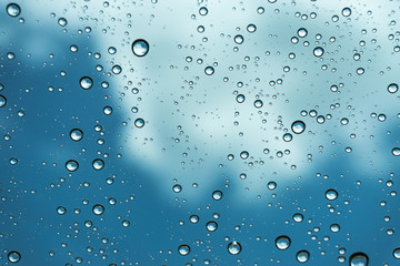 Rain on the window, natural skin of the rain The natural form of rainwater on a sky background.