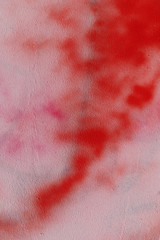 Spots of red paint on a concrete wall. Background image place for text.
