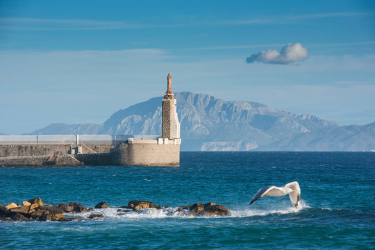 Sagrado Corazon de Jesus statue in harbour, Tarifa, Cadiz, Andalusia, Spain