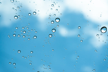Rain on the window, natural skin of the rain The natural form of rainwater on a sky background.