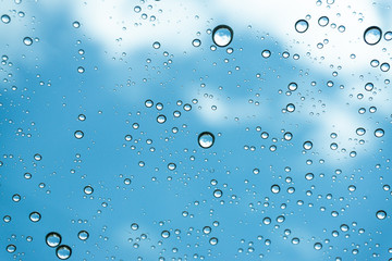 Rain on the window, natural skin of the rain The natural form of rainwater on a sky background.