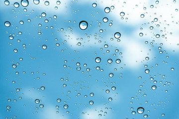 Rain on the window, natural skin of the rain The natural form of rainwater on a sky background.