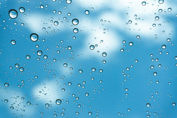 Rain on the window, natural skin of the rain The natural form of rainwater on a sky background.