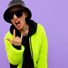 Hipster girl in a stylish street urban look. Fashion jacket and accessories