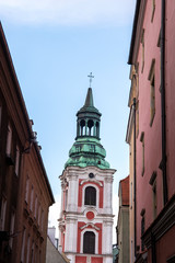Obraz premium View to the bell tower of Collegiate Church of Our Lady of Perpetual Help and St. Mary Magdalene, Poznan, Poland