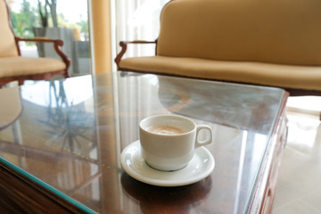 Coffee in a white cup and saucer. The hotel is all-inclusive. Break in the waiting room.
