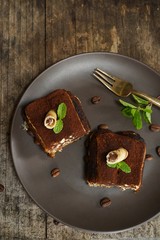 Square slice of Tiramisu cake, selective focus