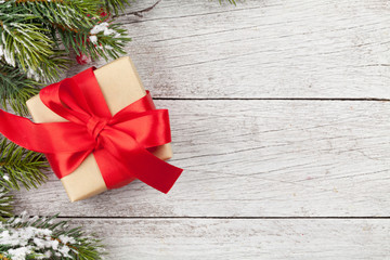 Fototapeta na wymiar Christmas gift box and fir tree branch