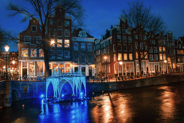Light Festival Amsterdam, floating blue light object on the in the canal Brouwersgracht in the old...