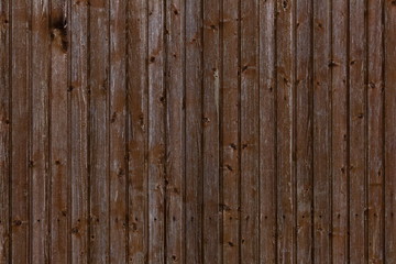 Wooden plank wall with a row of crosshead screws for background