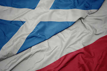 waving colorful flag of poland and national flag of scotland.