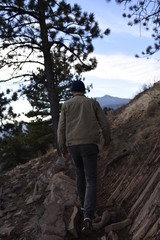 Man hiking in the woods on a mountain