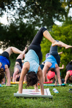 Group Of People Doing Yoga Outside