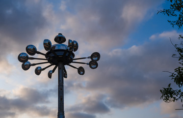 Symbol of an approaching thunderstorm or storm. Anemometer or wind speed meter silhouetted against cloudy background. Waiting for the storm and rain.
