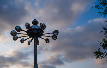 Symbol of an approaching thunderstorm or storm. Anemometer or wind speed meter silhouetted against...