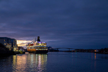Fototapeta na wymiar Coastal ships arrives at Bronnoysund harbor in Northern Norway