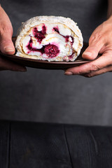 biscuit cake with raspberries and red berry jam on a plate