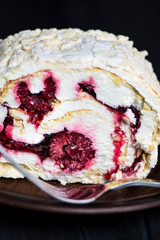  biscuit cake with raspberries and red berry jam on a plate
